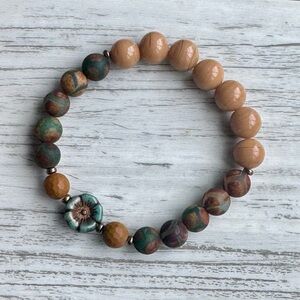 Elegant Beaded Bracelet with Floral Accent